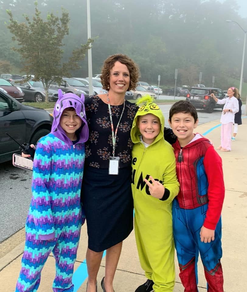Principal, Tammy Deaver, with 3 Fletcher Students in their Pajamas for Pajama Day
