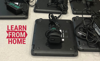 computers on table with "learn from home" text