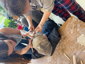 Students completing a paper Mache project