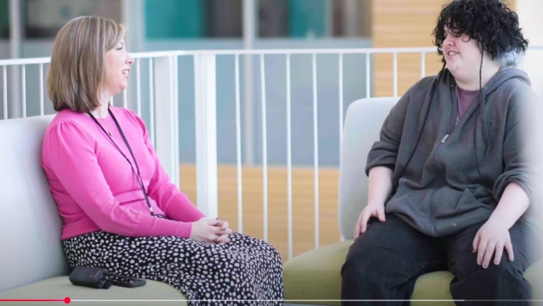 Principal and student talking together