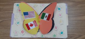 butterfly shaped book craft project with flags of the USA, Canada, and Mexico