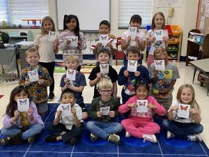 A classroom with students displaying their butterfly art