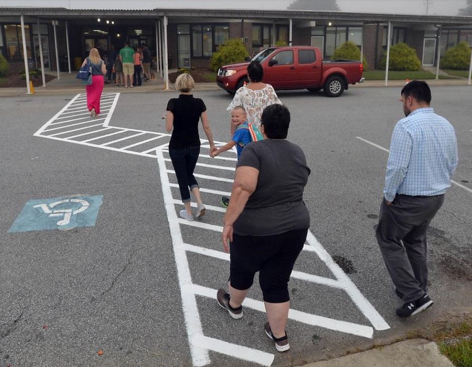 Parents and students in crosswalk