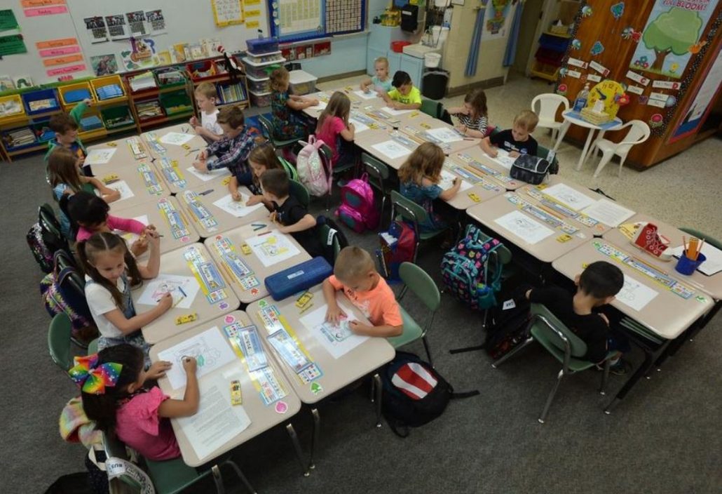 students coloring pictures