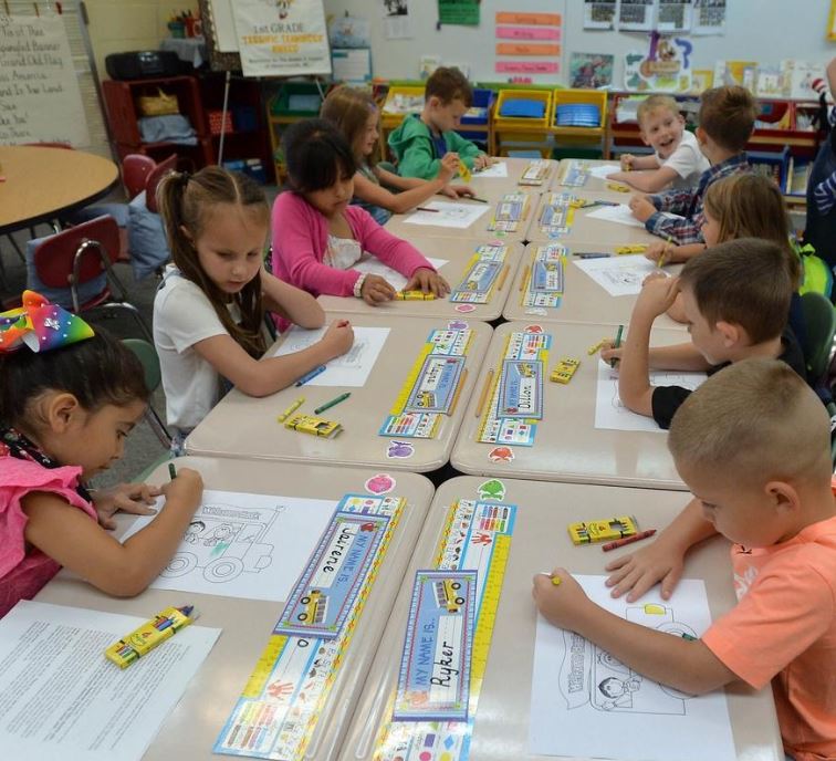 Students in classroom coloring