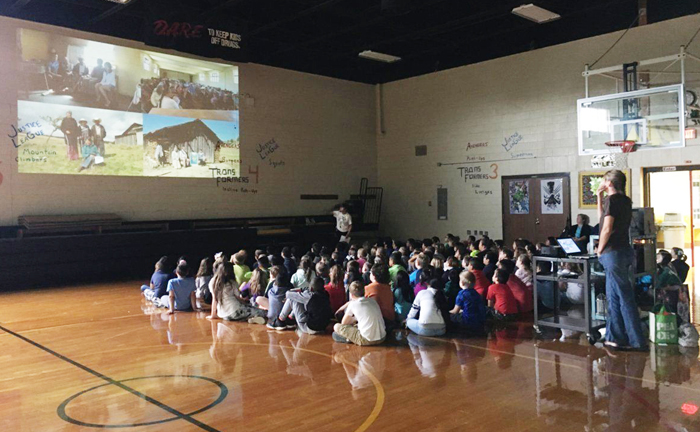 Estela Romero, who lives in Angangueo, Mexico near the El Rosario monarch overwintering sanctuary speaking to Edneyville students about the migration
