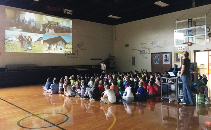 Estela Romero, who lives in Angangueo, Mexico near the El Rosario monarch overwintering sanctuary speaking to Edneyville students about the migration