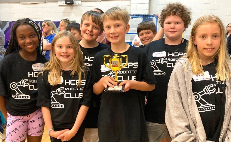 Students wearing black shirts that read HCPS Robotics Club