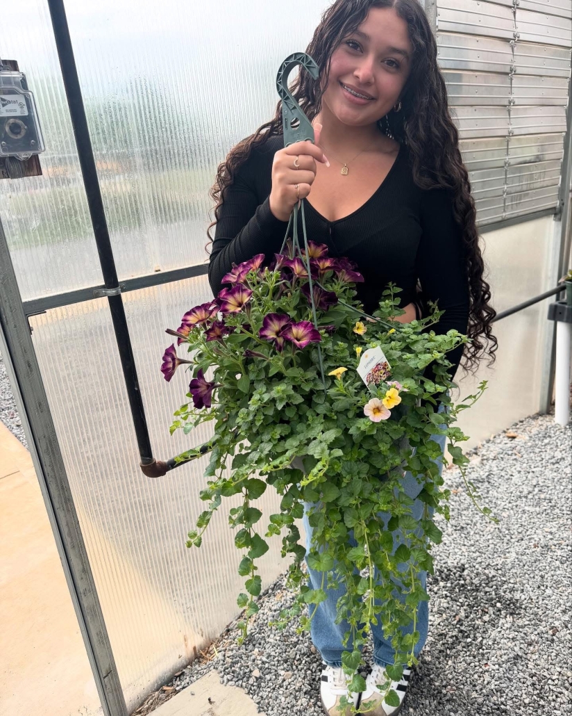 Jenni holding hanging plant