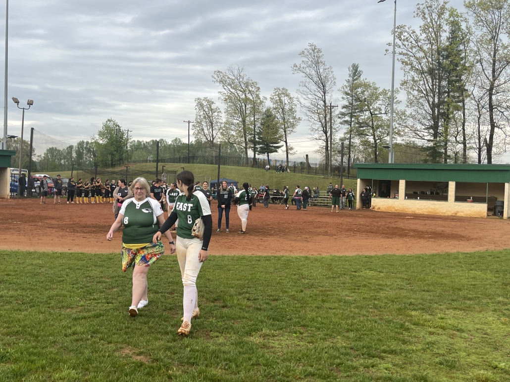 players and staff walking out on the field