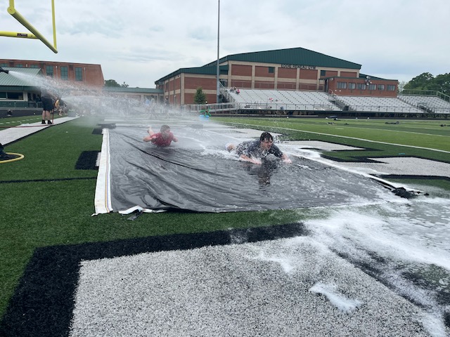 two students at the end of the slip'n'slide