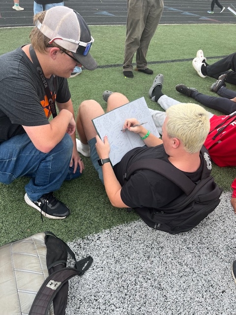 Barclay signing Luke's yearbook