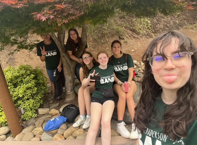 student selfie of group under tree