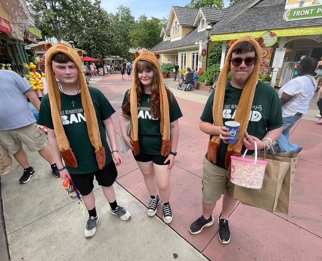 three students with matching silly hats