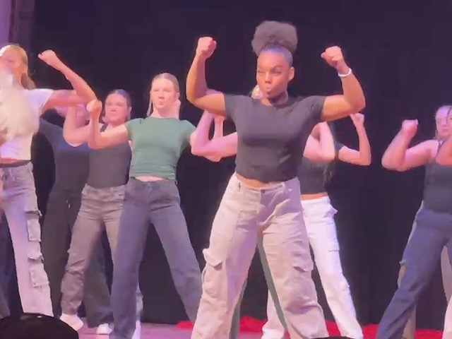 students dancing and flexing arms
