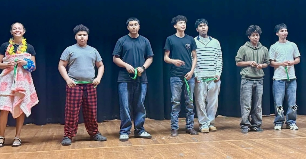 9th grade students on stage with medals 2