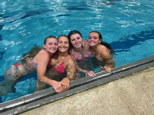 four girls in a pool