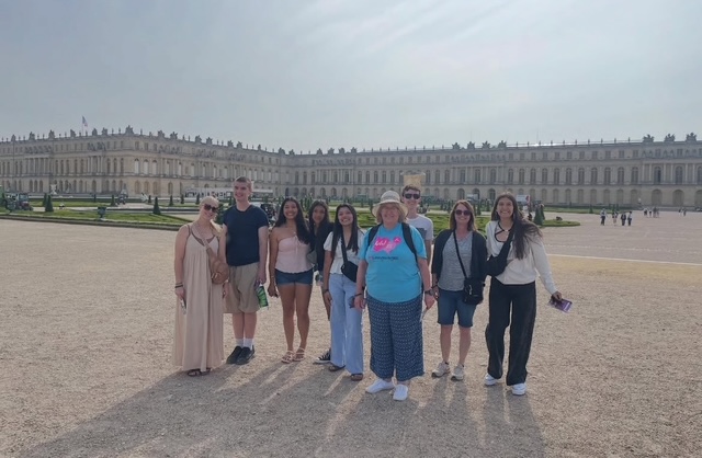 small group in front of Versailles with chaperones
