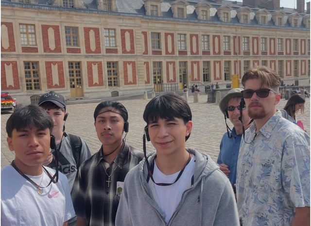 boys with chaperones in front of Versailles