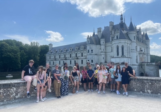 group photo in front of castle