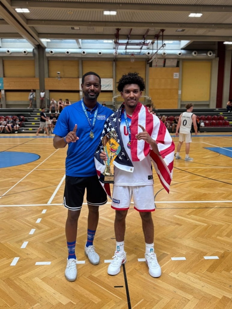 Coach Jones and Caiden with trophy and flag
