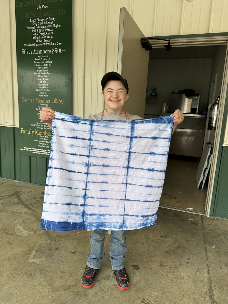 Hunter holding up towel project
