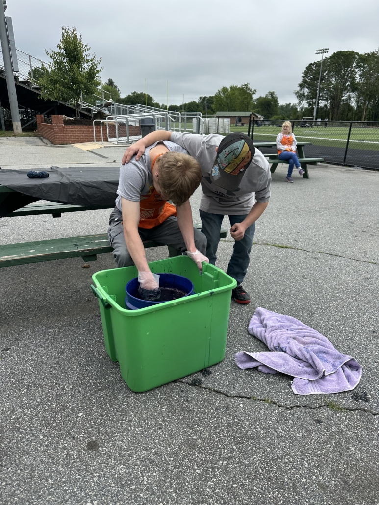 Phoenix and Hunter working together to dye their towels