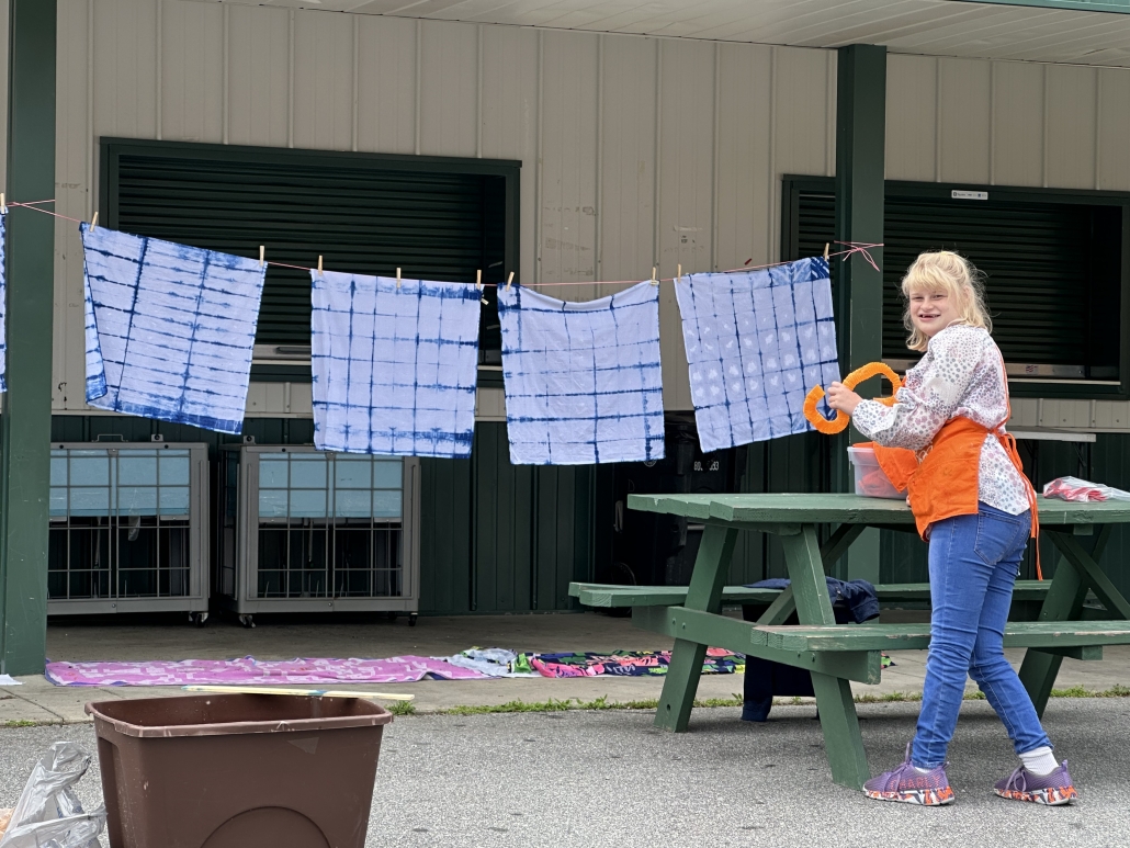 Ellie working on dying project at picnic dable
