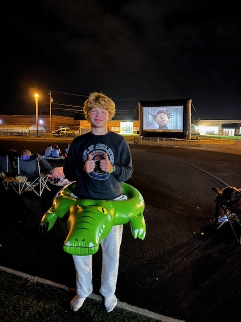 Jaxon with his inflatable with movie screen in background