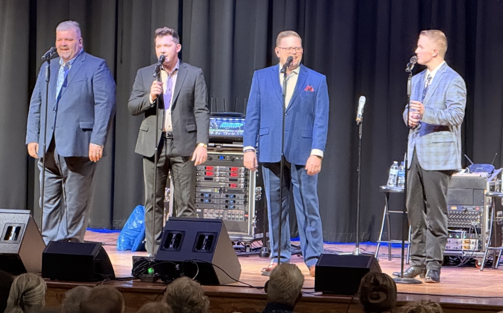 gospel group on stage preparing to sing