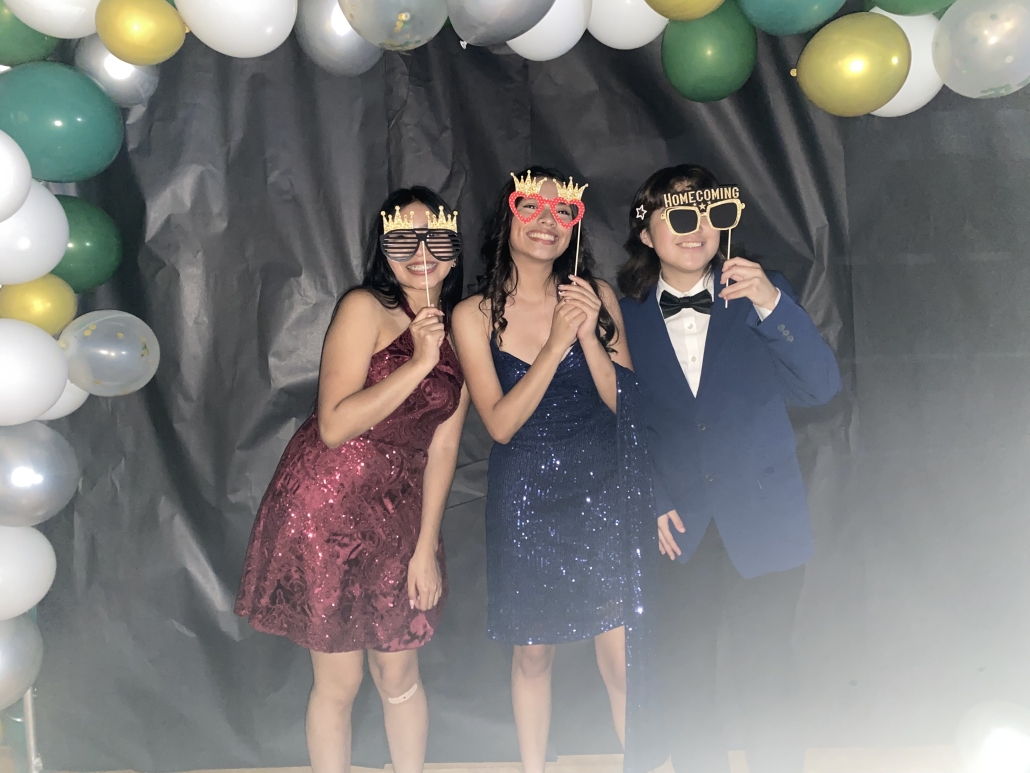 three girls in photo booth