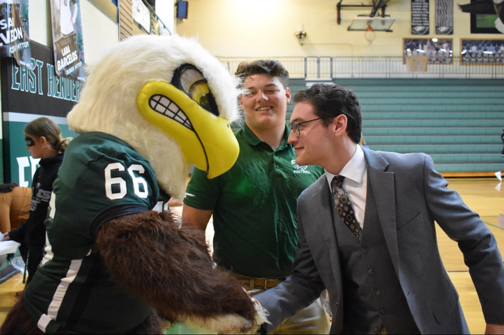 Dalton shaking Swoop's wing