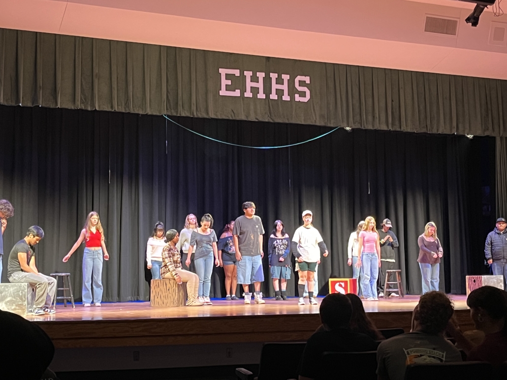 actors on stage spread out