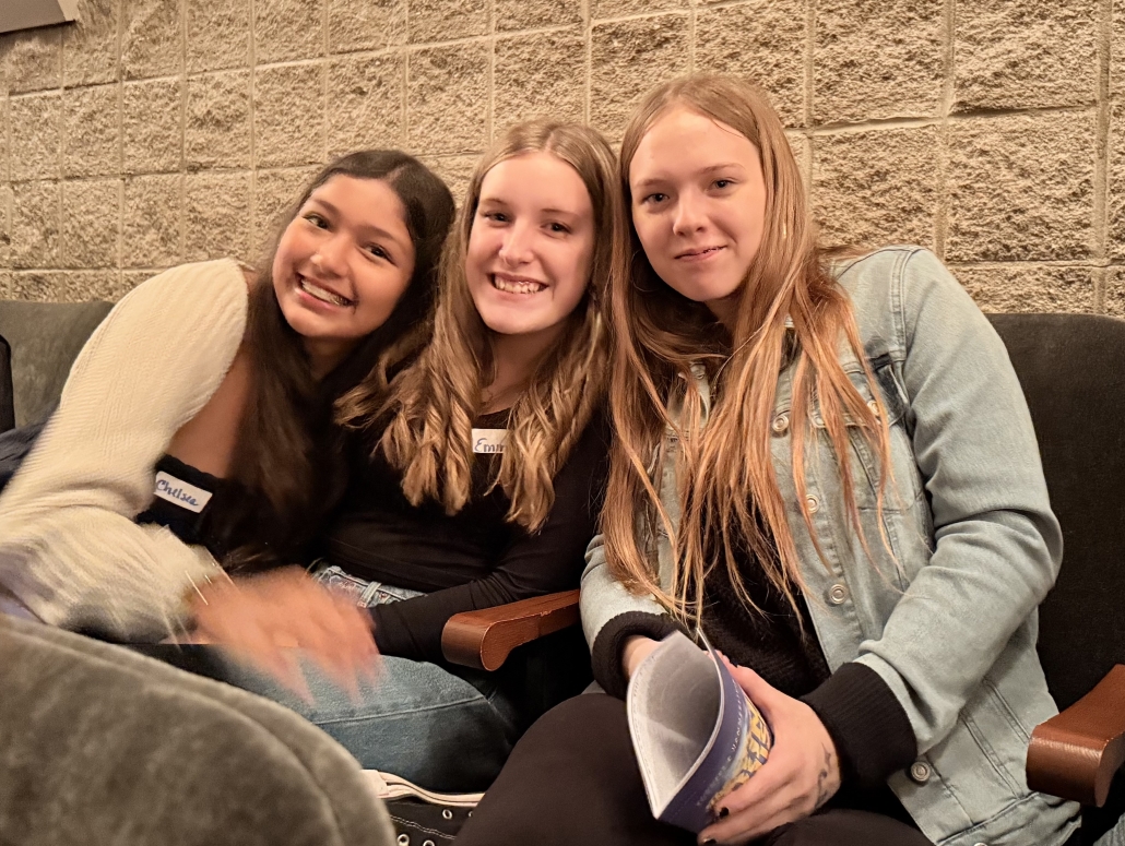 Group shot of three girls seated for the show