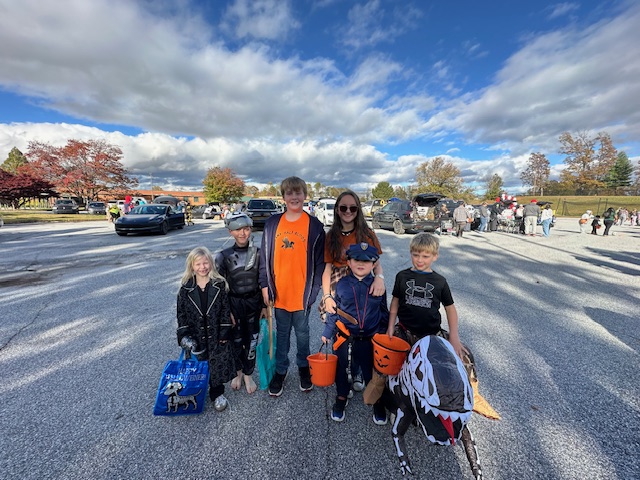 Teacher kids dressed up for Trunk or Treat