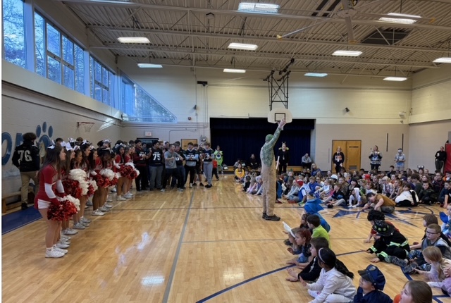Mr. Page leading the celebration in the gym