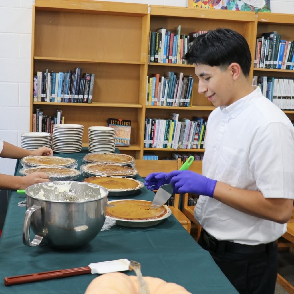 Enrique preparing to serve pie