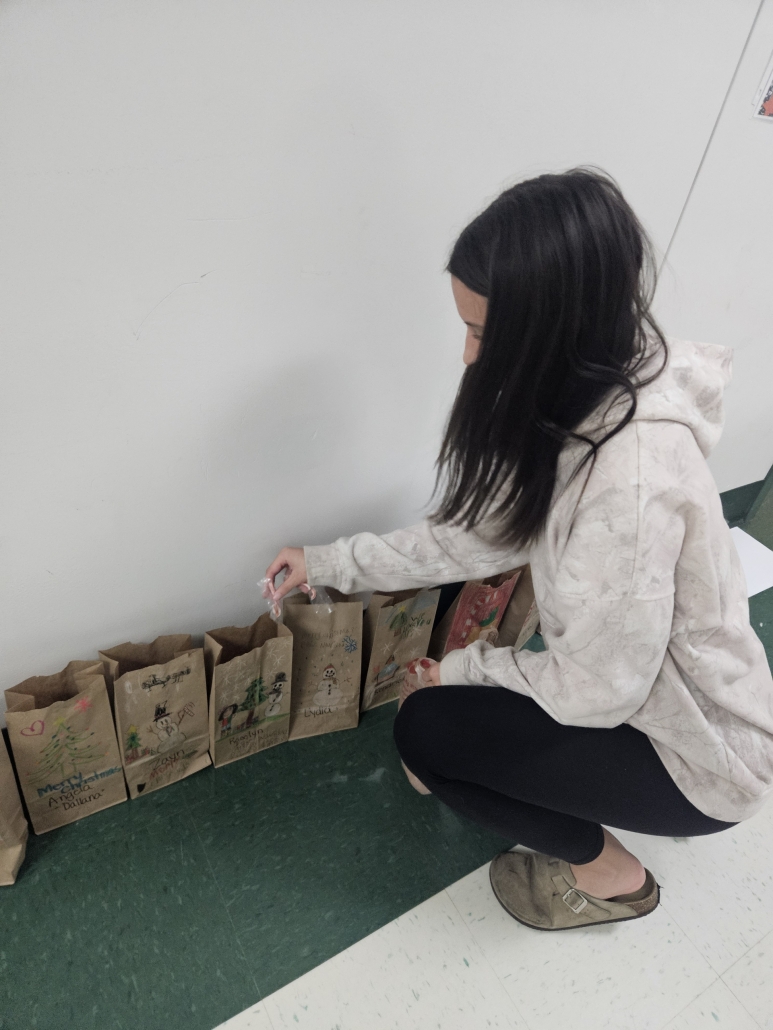 Emma filling a paper bag
