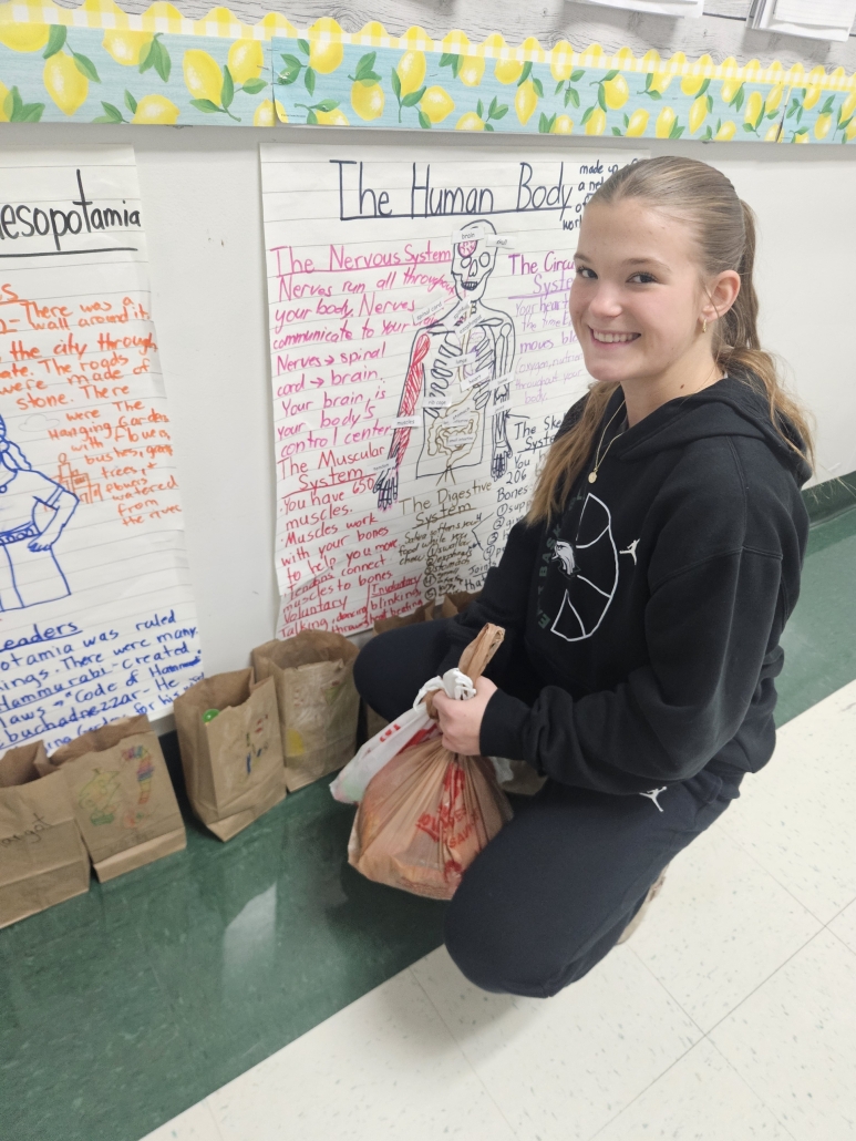 Addi filling a paper bag