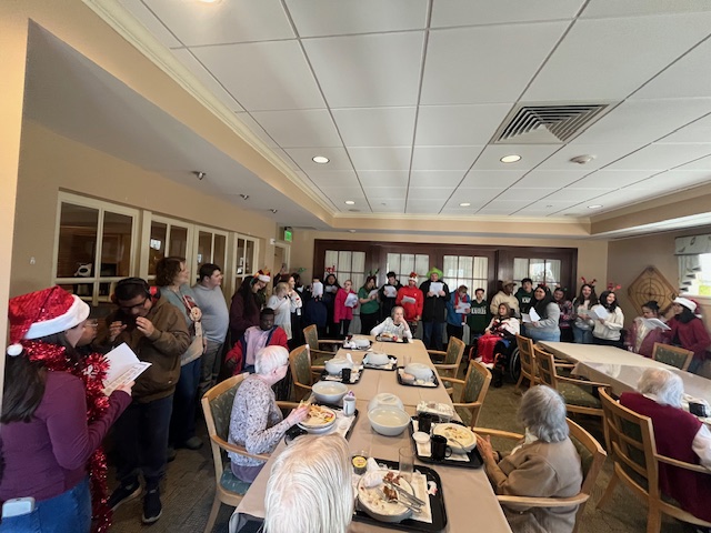 Group shot of SGA & EEs singing at Carolina Village
