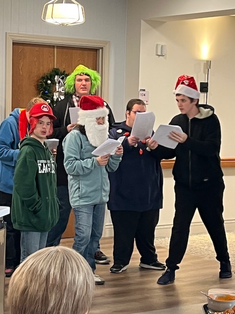 5 EE boys caroling together