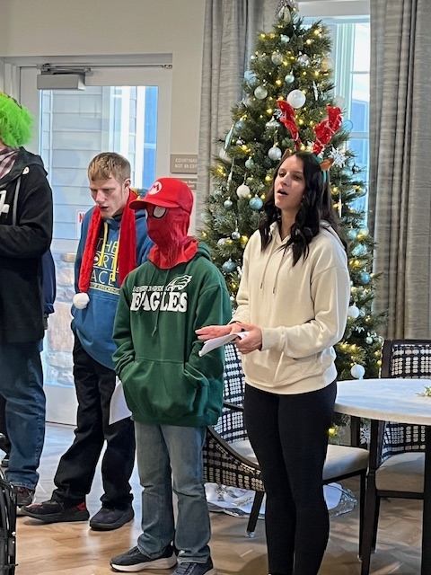 Phoenix, Hunter as Spiderman, and Emma caroling