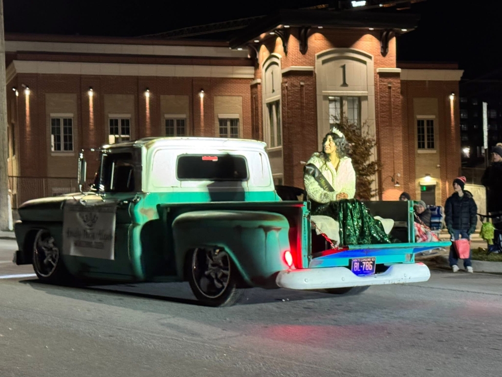 Homecoming Queen in truck in parade