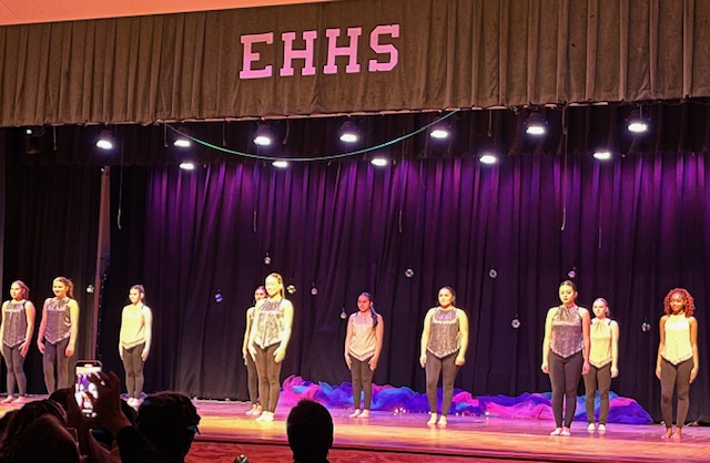 Dancers poised and ready on stage
