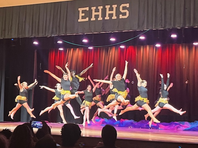 Dancers leaping on stage