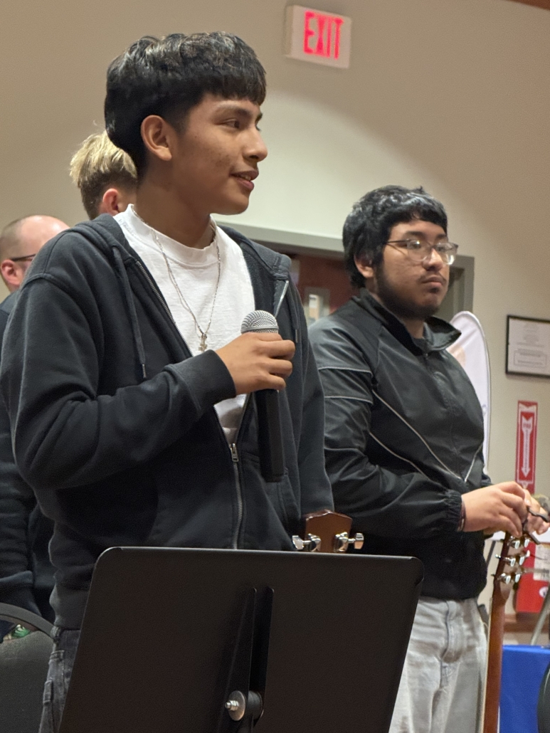 David talking on microphone