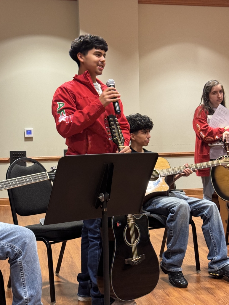 Alan talking on microphone