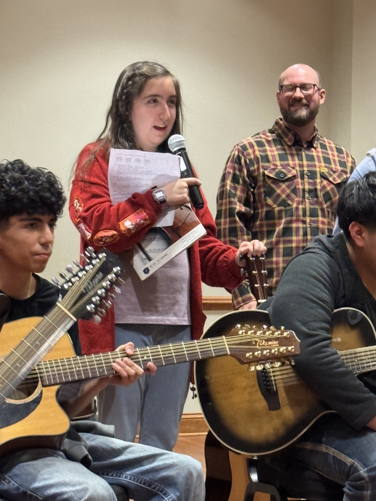 Taylor talking on microphone