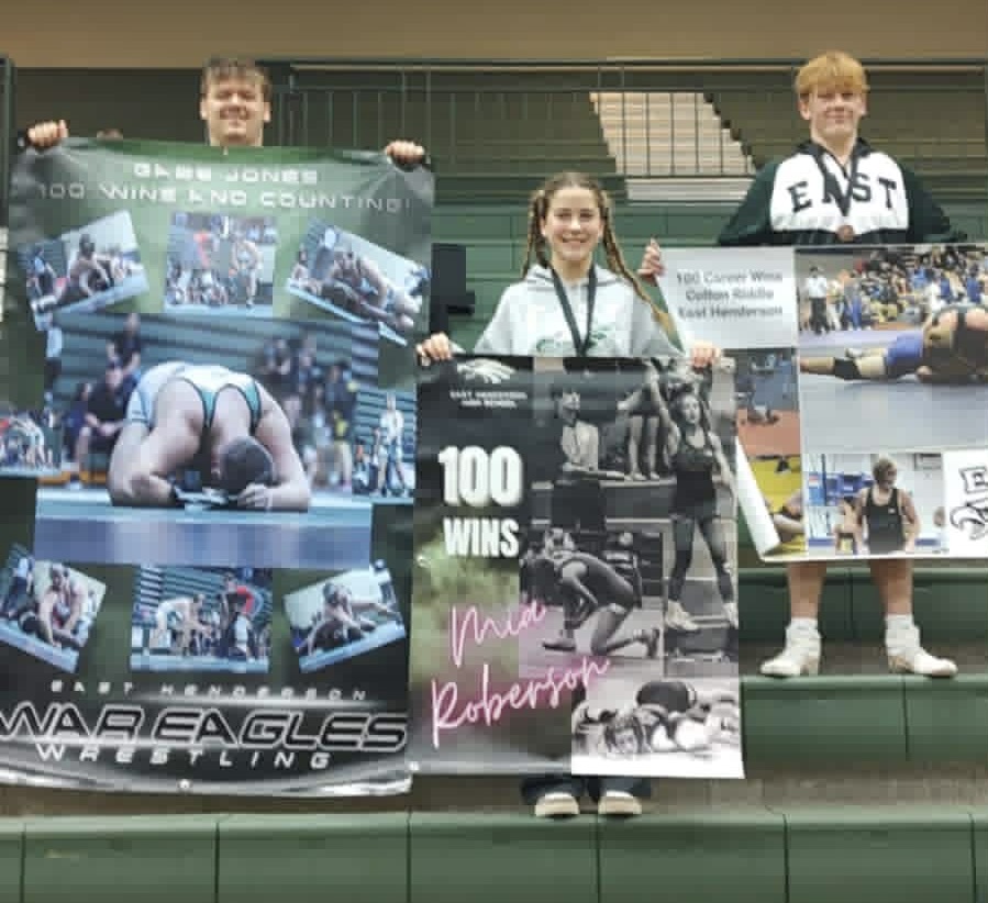 Gabe, Mia & Colton with their 100th win banners
