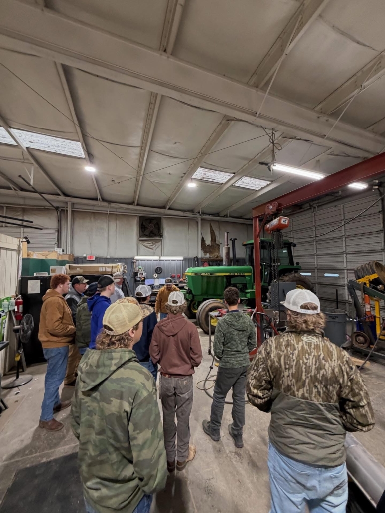 Students learning about a tracktor